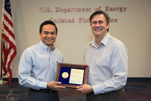 Department of Energy Carlsbad Field Office Site Operations Director Casey Gadbury (right) presents Farok Sharif, President and Project Manager for Nuclear Waste Partnership LLC, the management and operating contractor at the Waste Isolation Pilot Plant, with a 2012 DOE Sustainability Award during a recognition event at WIPP. More than 20 CBFO and contractor employees were recognized with sustainability awards in four categories.